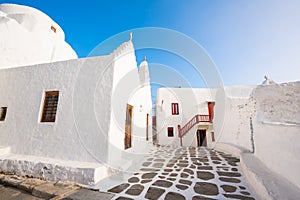 White cycladic architecture on the street in Mykonos town, Mykonos island, Greece