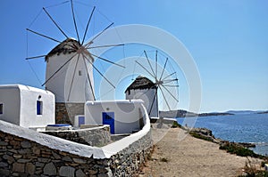 White cycladic windwill in a sunny day