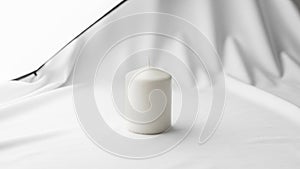 Cylindrical candle is placed on a smooth surface with a backdrop of gently