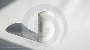 Casts an elongated shadow to the left indicating a light source from the