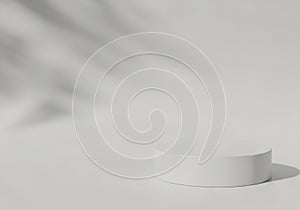 A white cylindrical object casting a soft shadow on a plain background