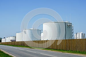 White cylindrical storage tanks for petroleum products