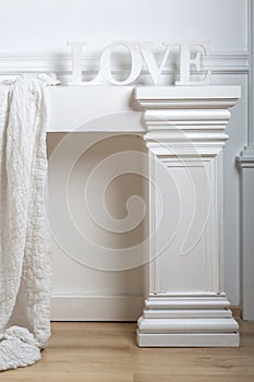 White decoration for a studio with a cloth, column