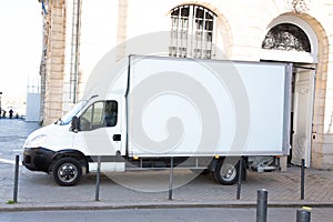 White delivery Truck with Blank panel on city street