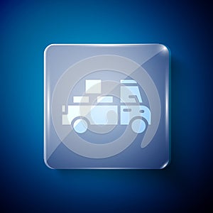 White Delivery truck with cardboard boxes behind icon isolated on blue background. Square glass panels. Vector