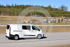 White Delivery Van at Speed