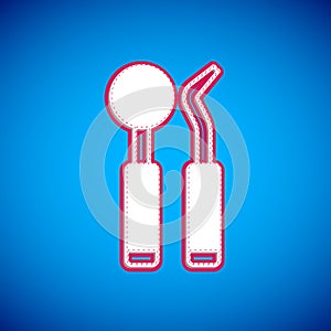 White Dental inspection mirror and probe icon isolated on blue background. Explorer scaler. Tool dental checkup. Vector