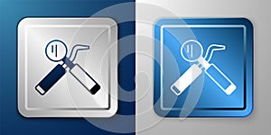 White Dental inspection mirror and probe icon isolated on blue and grey background. Explorer scaler. Tool dental checkup