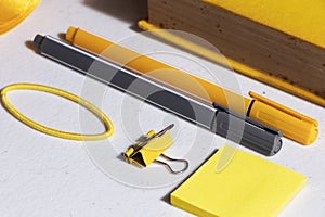 White table with yellow and gray tools for bullet journal