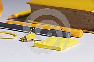 White table with yellow and gray tools for bullet journal