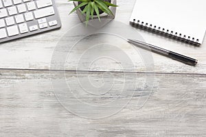 White desk office with laptop, smartphone and other work supplies with cup of coffee. Top view with copy space for input