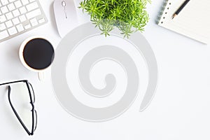 White desk office with laptop, smartphone and other work supplies with cup of coffee. Top view with copy space for input the text