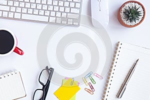 White desk office with laptop, smartphone and other work supplies with cup of coffee. Top view with copy space for input the text