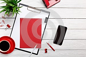White desk boards folder red notepad cup morning coffee clock paper clip workflow meeting