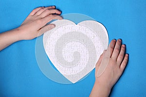 White details of a puzzle on a blue background. A puzzle is a pu