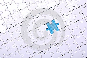 White details of a puzzle on a blue background. A puzzle is a pu