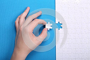 White details of a puzzle on a blue background. A puzzle is a pu