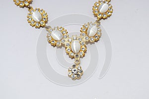 White Diamond jewelry ,gold traditional indian necklace jewellery  design on white background