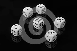 White dice on black background