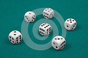 White dice on green felt