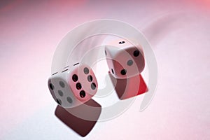 White Dice in Motion on a White Shadowy Background