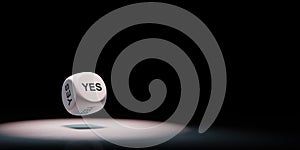 Yes Text Dice Spotlighted on Black Background photo