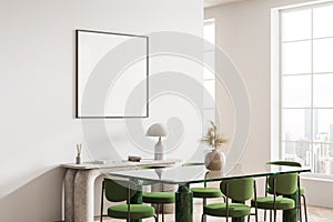 White dining room corner with green chairs and poster