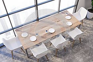 White dining room with laid table, top view