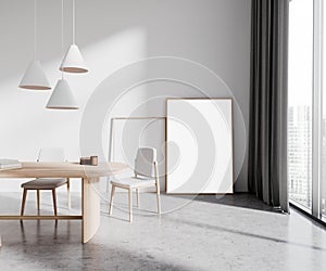 White dining room with poster on floor