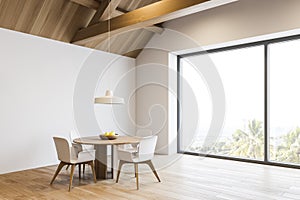 White dining room in spacious mansion