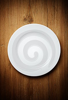White Dinner Plate on Wood