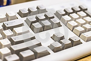 White and dirty keyboard of an old desktop computer