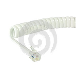 White disconnected telephone handset extension cord, curly coil line spiral wire cable, isolated 4P4C RJ22 connector jack