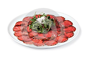 White dish with carpaccio of beef