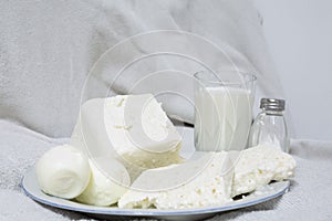 White dishes at white fabric as a background