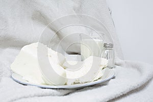 White dishes at white fabric as a background
