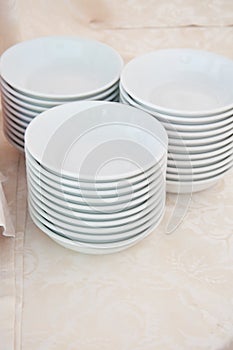 White dishes on a table ready for breakfast