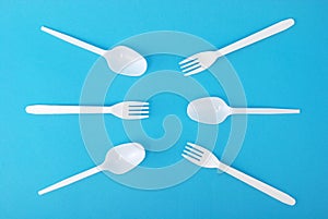 White disposable dishes, fork and spoon