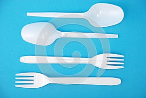 White disposable dishes, fork and spoon