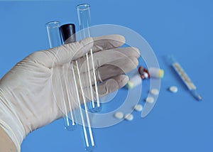 White disposable gloves. Coronavirus, personal protective equipment, disposable medical mask, drugs with a syringe, vaccine