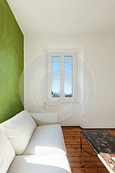 White divan, interior photo
