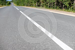 White dividing line on the asphalt road
