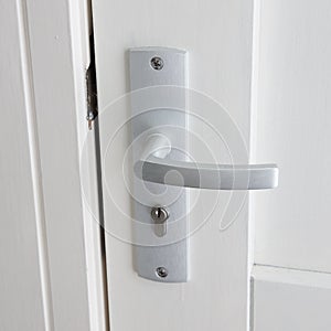 White door with chrome doorhandle