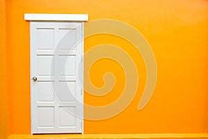 White door classic vintage on the color orange wall