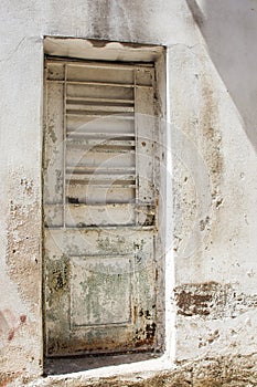 White door with flaking paintwork