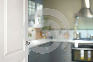 White door opened to the kitchen, blurred background