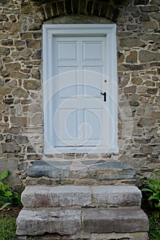 White Door in Rustic Stone Wall