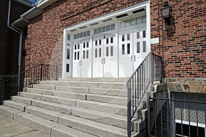 White doors for a red brick building