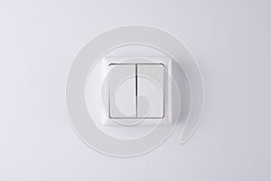 White double light switch isolated on white background