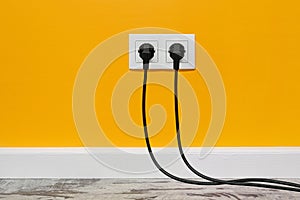 White double outlet on yellow wall